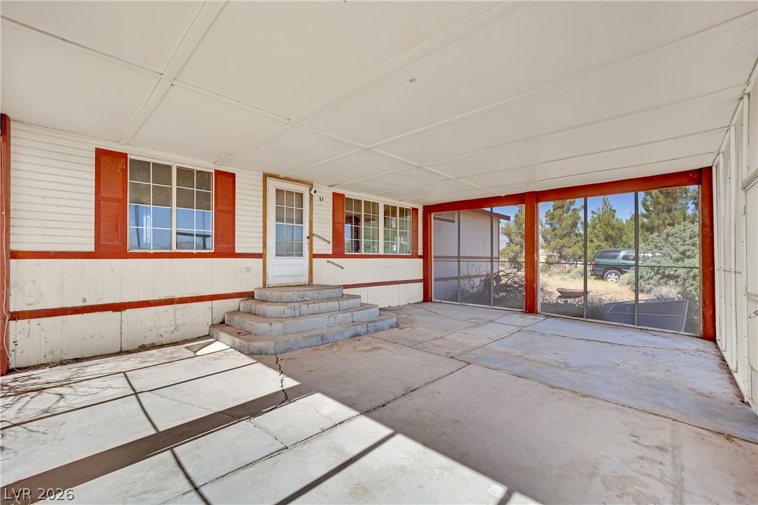 4361 Maple Road Pahrump, NV 89048 - Photo 34 of 46 A spacious screened-in porch offers outdoor living and serene views.