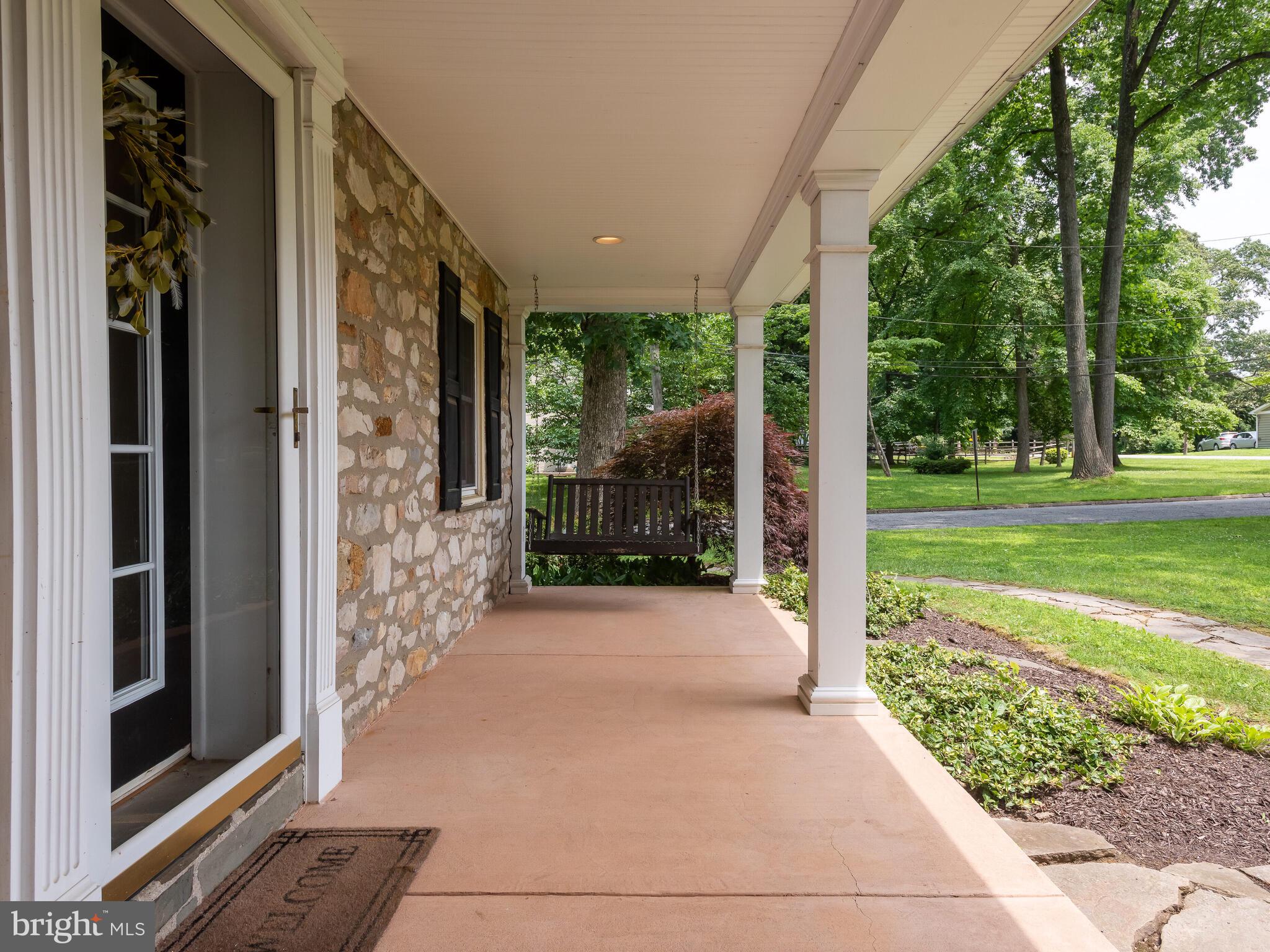 157 Summit Road Malvern, PA 19355 - Photo 46 of 56 covered front porch with porch swing