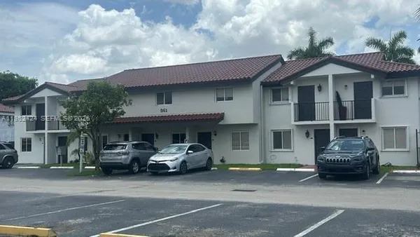a car parked in front of a house