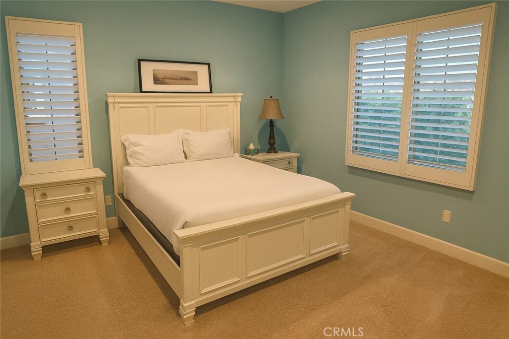 20 Tenderfoot Irvine, CA 92602 - Photo 12 of 26 a bed sitting in a bedroom next to a window