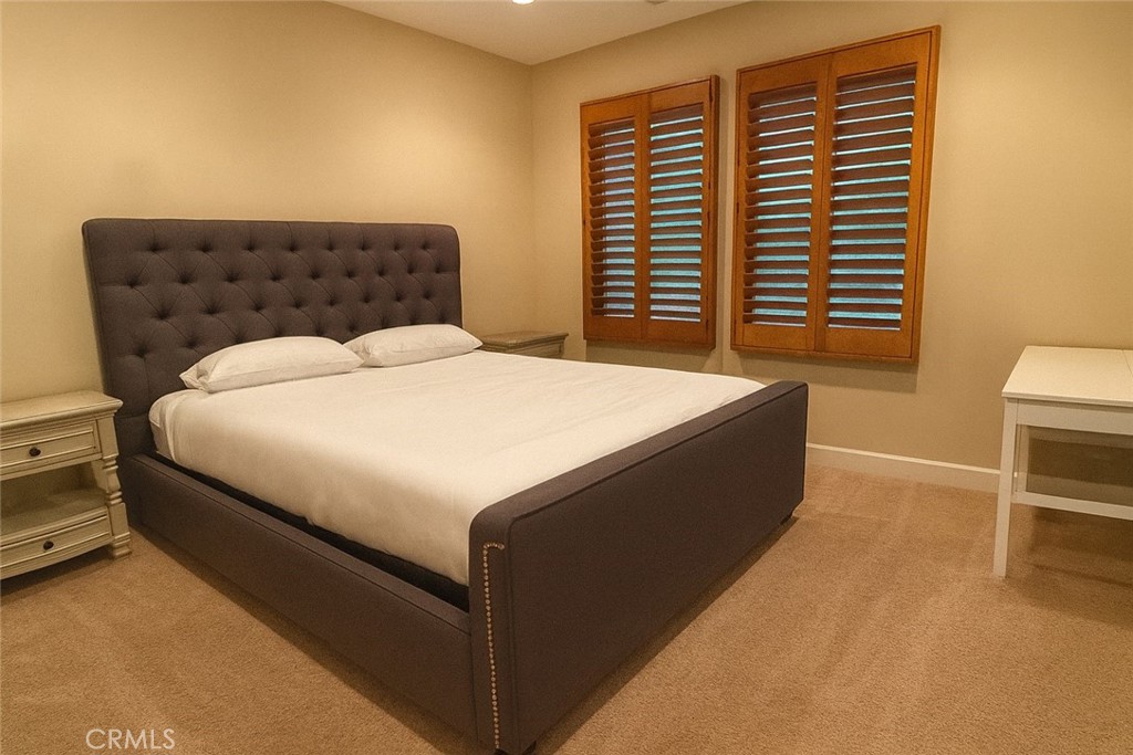 20 Tenderfoot Irvine, CA 92602 - Photo 14 of 26 a bed sitting in a bedroom next to a window