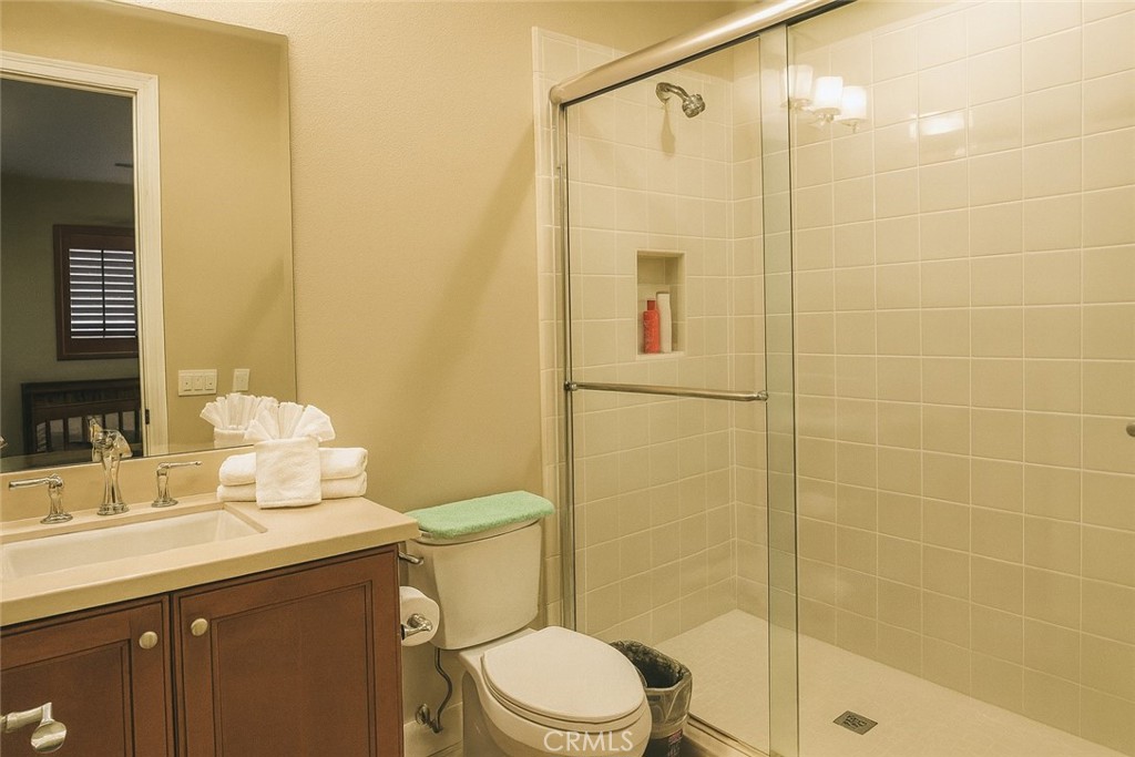 20 Tenderfoot Irvine, CA 92602 - Photo 18 of 26 a bathroom with a sink a toilet and shower