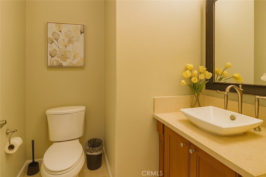 20 Tenderfoot Irvine, CA 92602 - Photo 19 of 26 a bathroom with a sink and a toilet