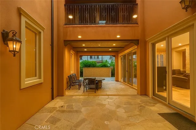 a view of a patio with table and chairs