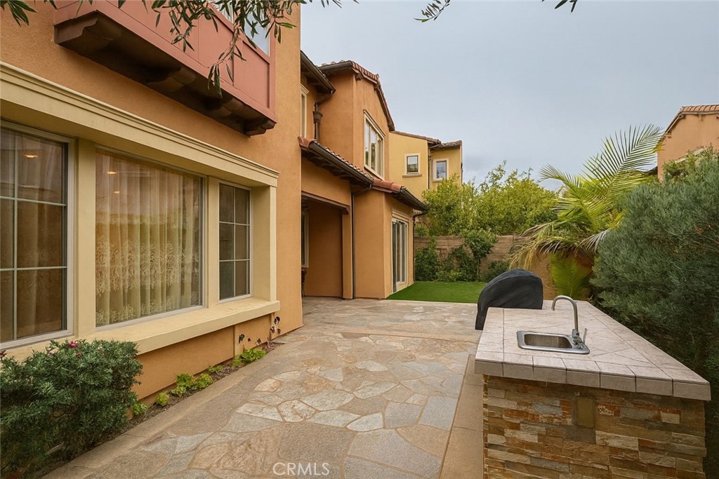 20 Tenderfoot Irvine, CA 92602 - Photo 24 of 26 a front view of a house with a yard