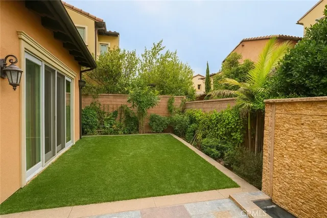 a view of a back yard from a balcony