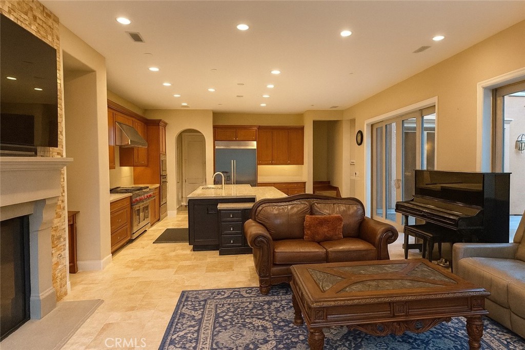 20 Tenderfoot Irvine, CA 92602 - Photo 6 of 26 a living room with furniture and a flat screen tv
