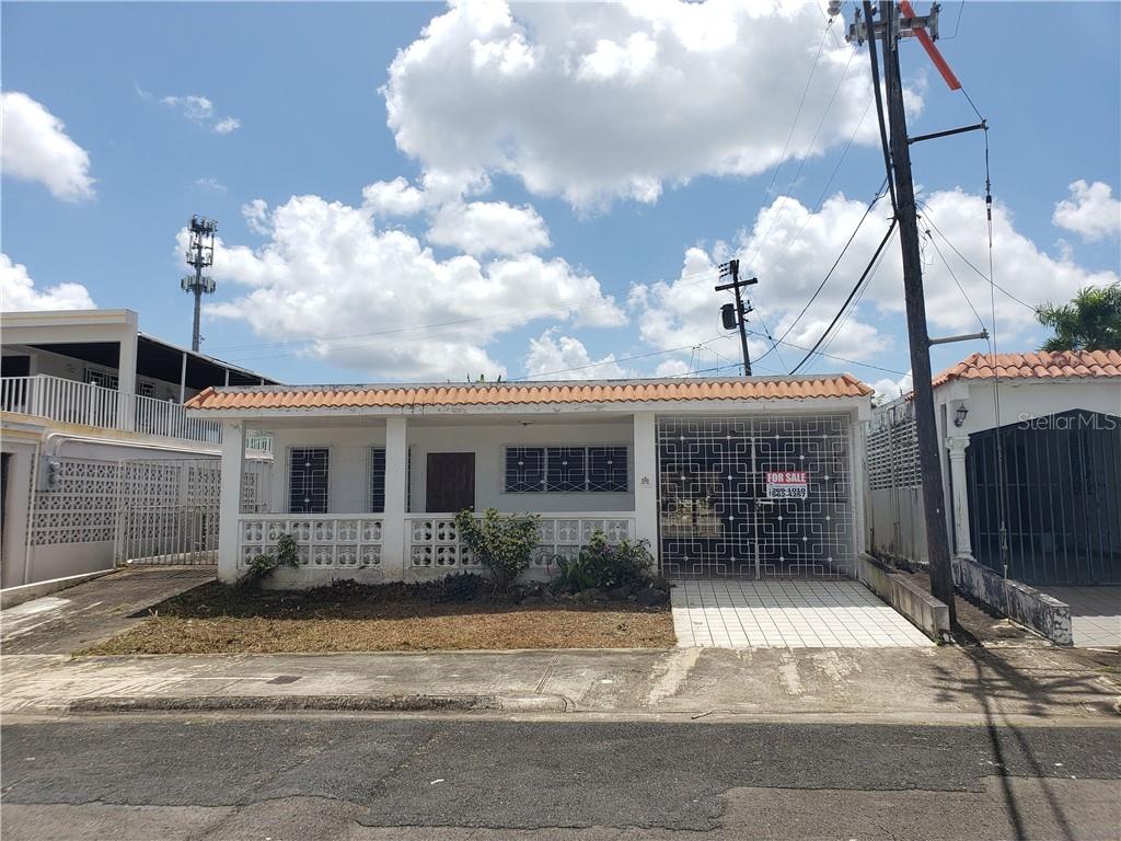 Alicea Alicea Street, Unit F49 Bayamon, Bayamón 00957 - Photo 1 of 1 a front view of a house with garden