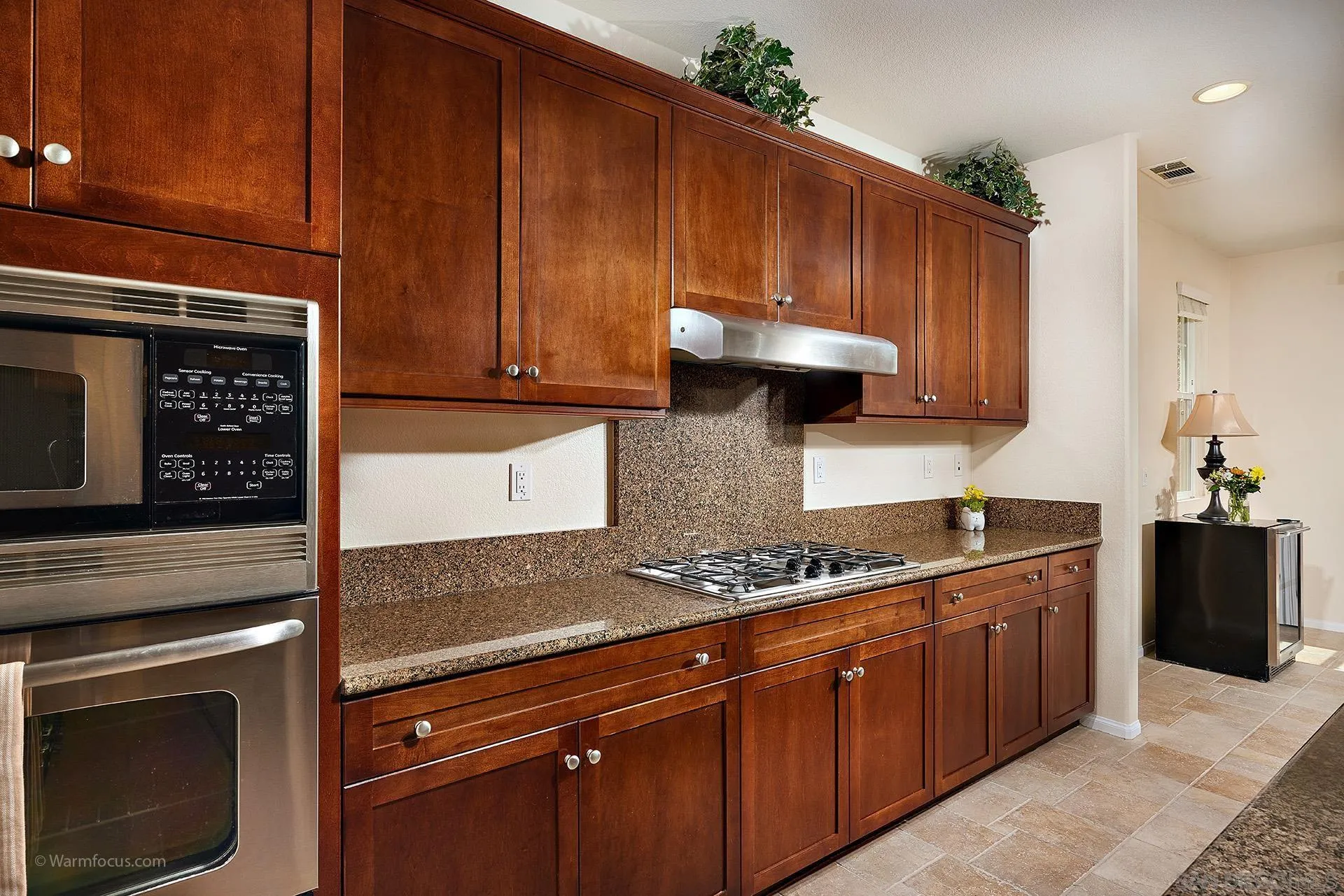 3025 Calico Street Santee, CA 92071 - Photo 15 of 59 a kitchen with stainless steel appliances granite countertop a stove a sink and a microwave