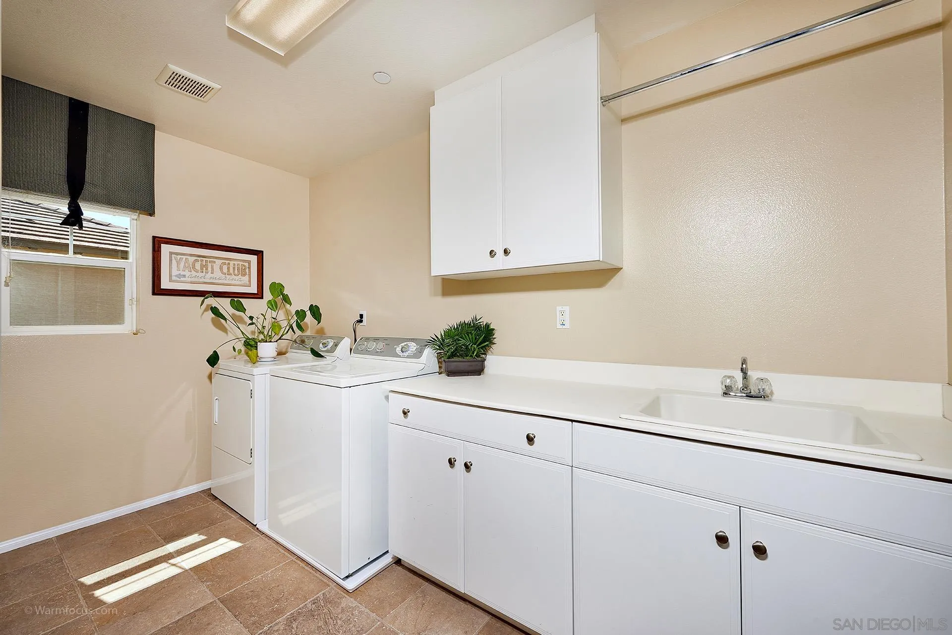3025 Calico Street Santee, CA 92071 - Photo 22 of 59 a bathroom with a sink and a mirror