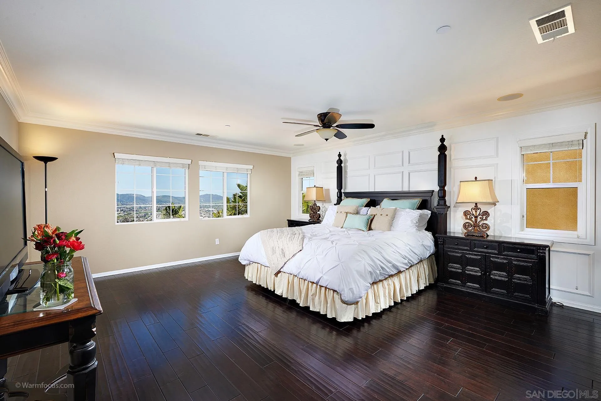 3025 Calico Street Santee, CA 92071 - Photo 26 of 59 a spacious bedroom with a bed and wooden floor