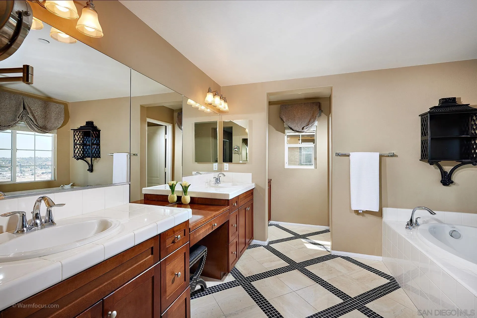 3025 Calico Street Santee, CA 92071 - Photo 28 of 59 a spacious bathroom with a granite countertop sink and a mirror