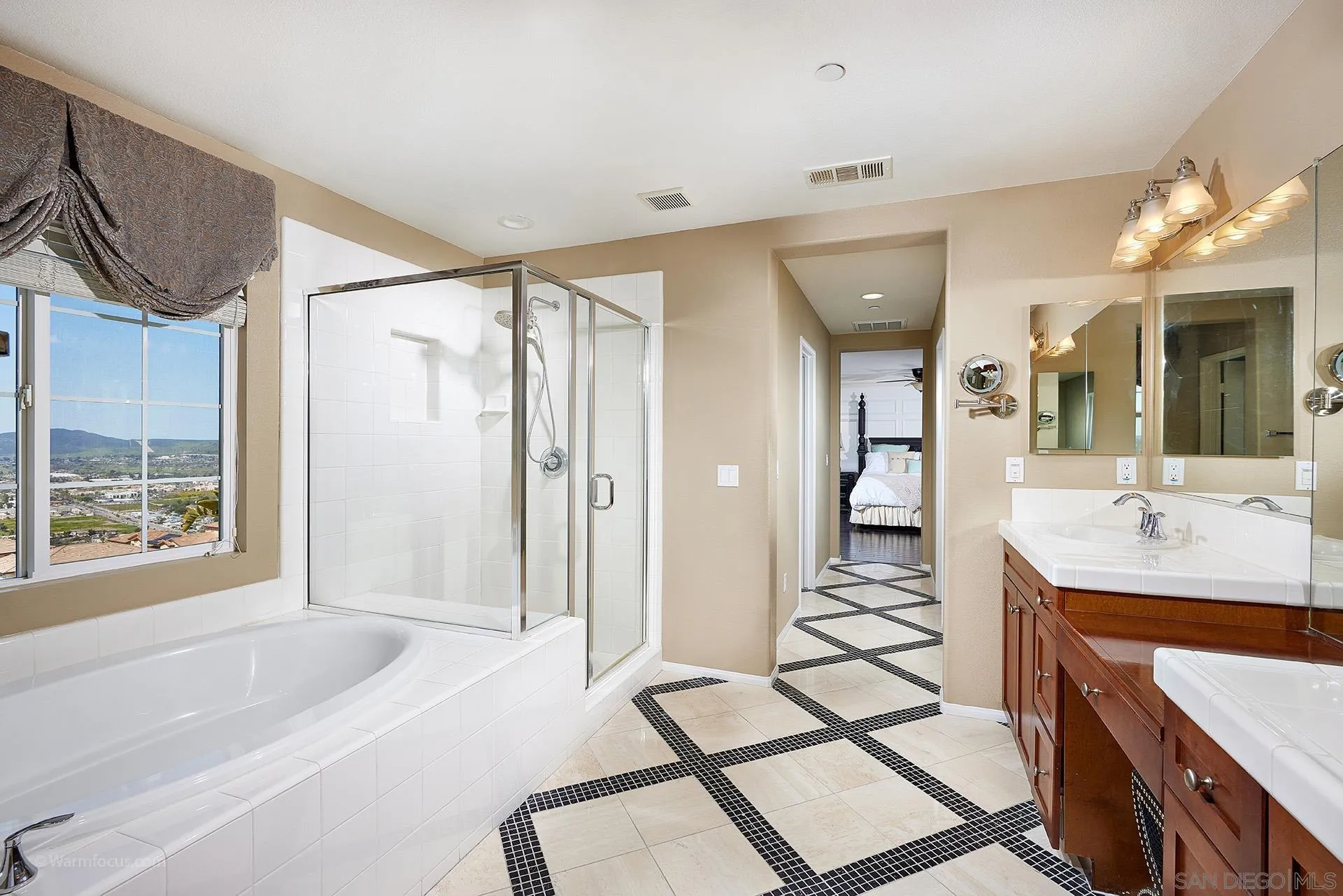 3025 Calico Street Santee, CA 92071 - Photo 29 of 59 a spacious bathroom with a tub sink shower and mirror