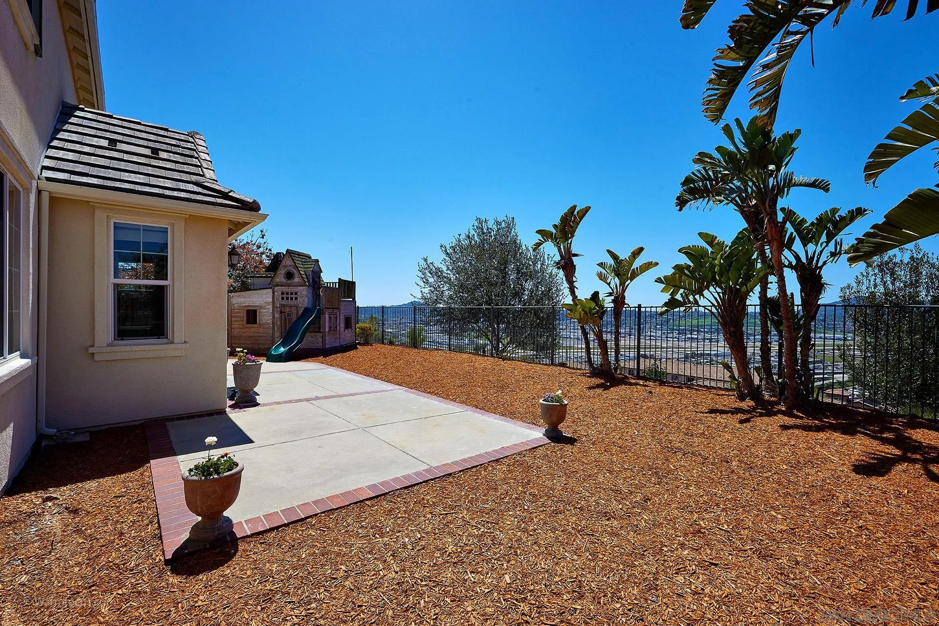 3025 Calico Street Santee, CA 92071 - Photo 40 of 59 a backyard of a house with barbeque oven table and chairs
