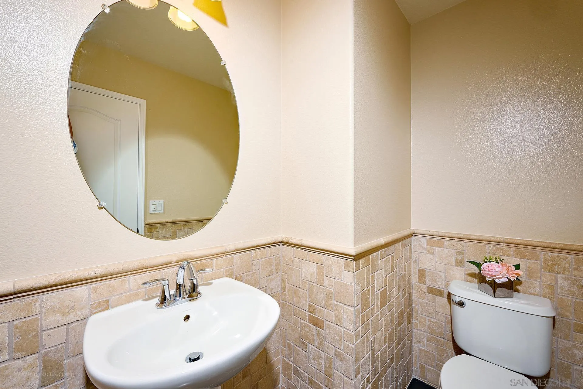3025 Calico Street Santee, CA 92071 - Photo 9 of 59 a bathroom with a sink and mirror