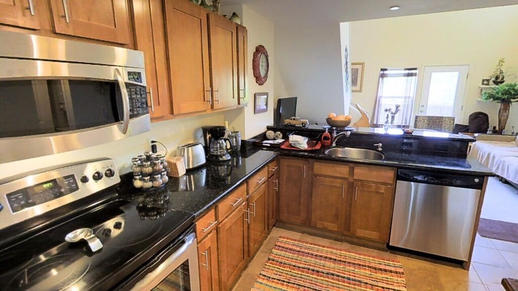 a kitchen with a sink stove and cabinets