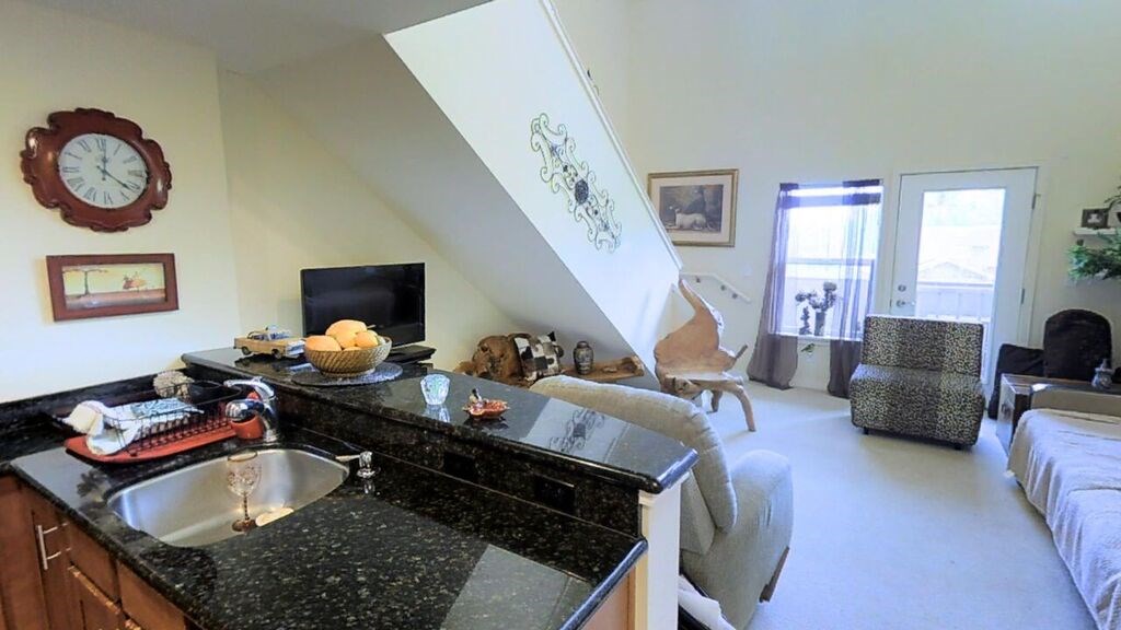 3710 Lower Honoapiilani Road, Unit F44 Lahaina, HI 96761 - Photo 12 of 17 a living room with furniture and a wooden floor