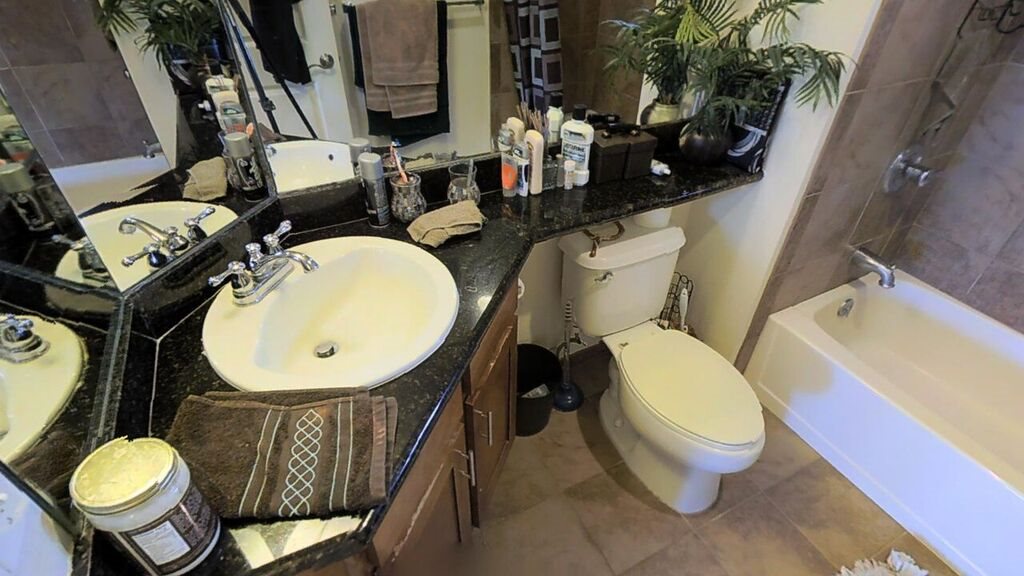 3710 Lower Honoapiilani Road, Unit F44 Lahaina, HI 96761 - Photo 4 of 17 a bathroom with a toilet mirror and sink