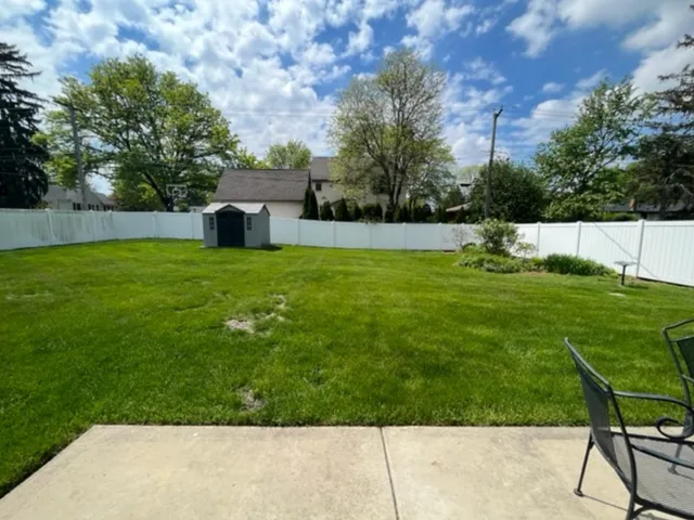 a backyard of a house with lots of green space
