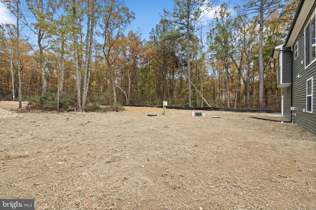 a view of snow on middle of a yard