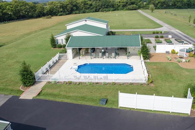 6317 Lampkins Bridge Road College Grove, TN 37046 - Photo 20 of 28 a view of a swimming pool with a yard