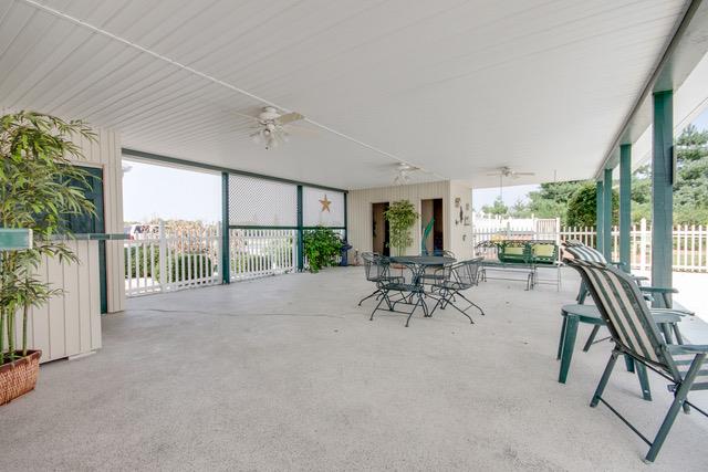 6317 Lampkins Bridge Road College Grove, TN 37046 - Photo 22 of 28 a view of a work space with furniture and floor to ceiling window
