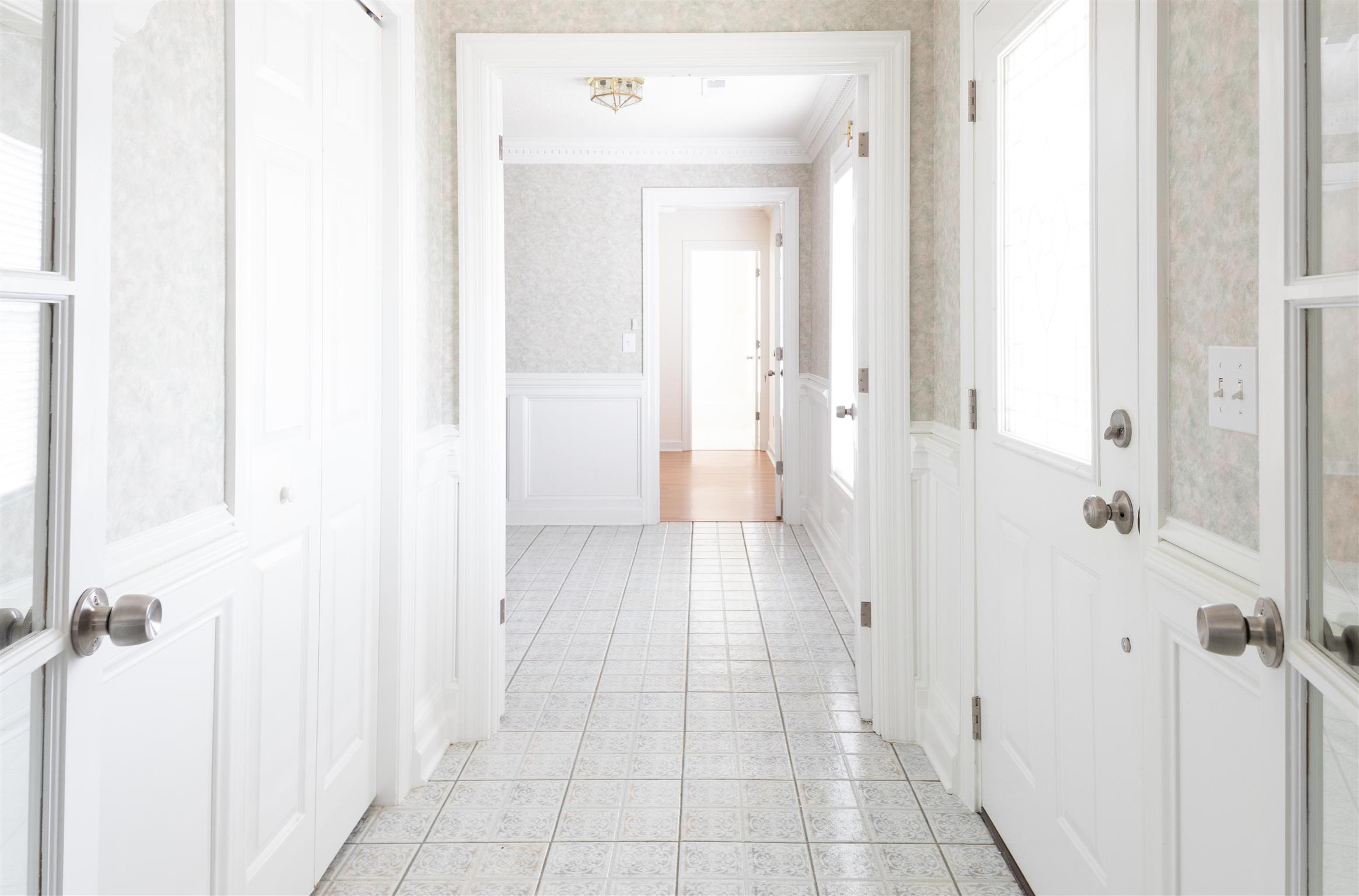 6317 Lampkins Bridge Road College Grove, TN 37046 - Photo 3 of 28 a view of a hallway with a cabinet and a mirror