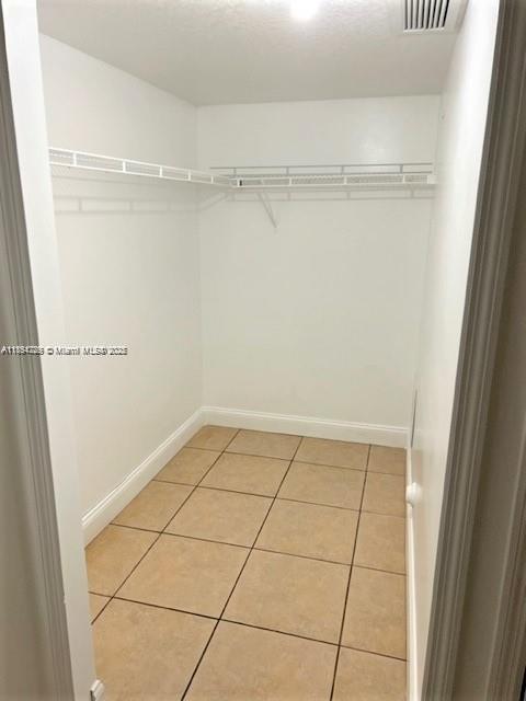2920 Southeast 13th Road, Unit 10445 Homestead, FL 33035 - Photo 12 of 13 a view of a room with racks on the wall