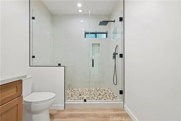 a bathroom with a shower and a toilet