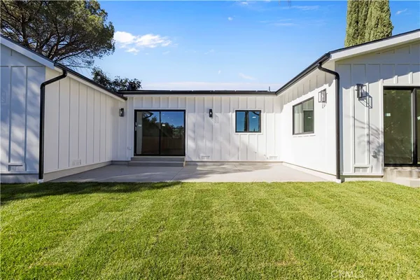 a house view with a garden space