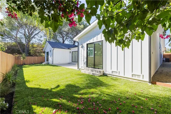 a house with a tree in front of it
