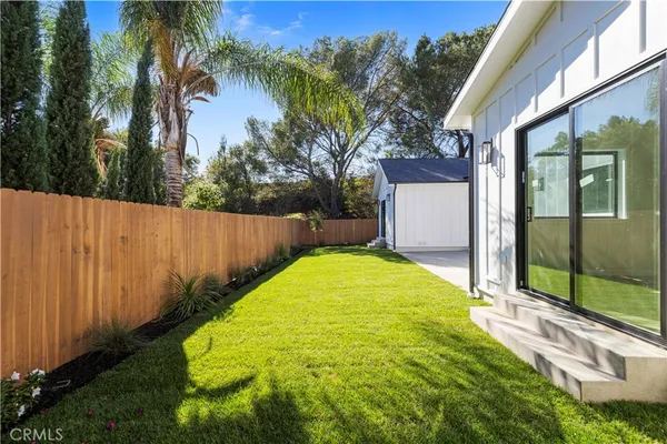 a view of outdoor space and backyard