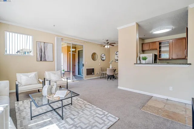 a white refrigerator freezer sitting in a kitchen with stainless steel appliances granite countertop a refrigerator sink and stove