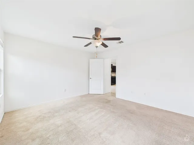 a bathroom with a double vanity sink mirror and bathtub
