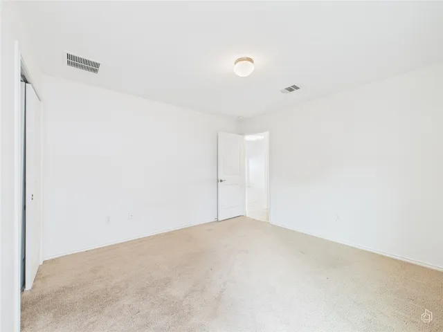 a bathroom with a bathtub shower sink vanity mirror and toilet