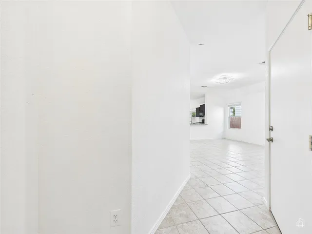 a view of kitchen with furniture and a window