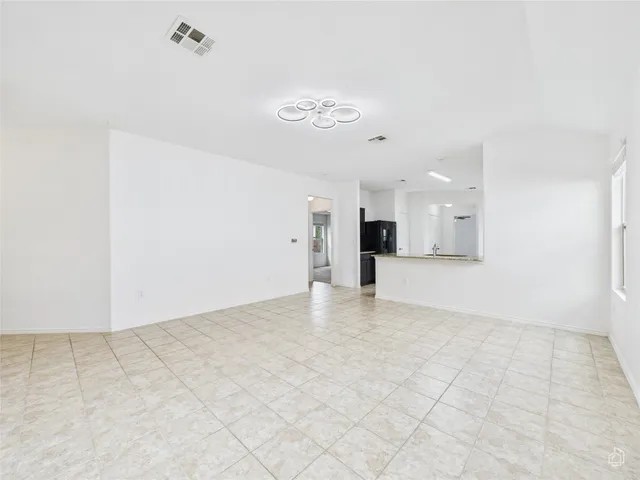 a kitchen with stainless steel appliances a refrigerator and a sink