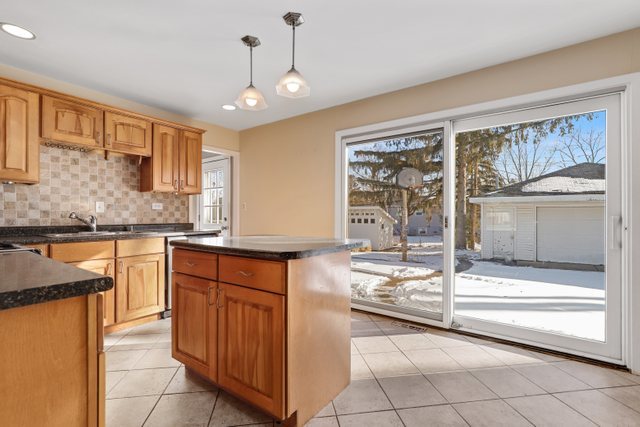 307 Oakwood Road Vernon Hills, IL 60061 - Photo 13 of 28 a kitchen with stainless steel appliances granite countertop a stove and a sink