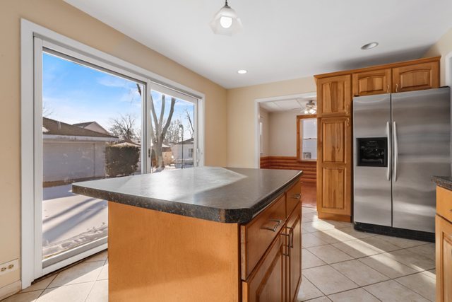 307 Oakwood Road Vernon Hills, IL 60061 - Photo 14 of 28 a kitchen with stainless steel appliances granite countertop a sink and a refrigerator