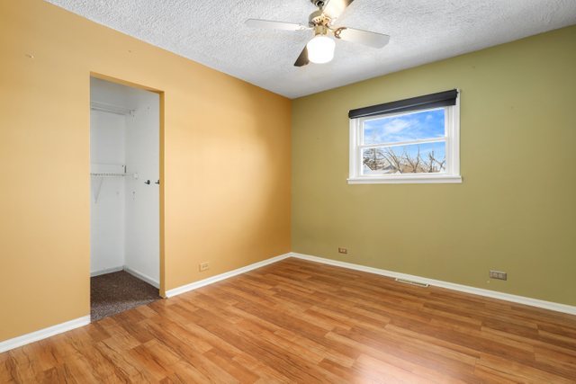 307 Oakwood Road Vernon Hills, IL 60061 - Photo 21 of 28 a view of an empty room with wooden floor