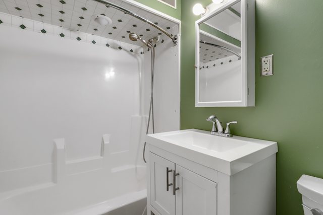 307 Oakwood Road Vernon Hills, IL 60061 - Photo 23 of 28 a bathroom with a sink and a mirror