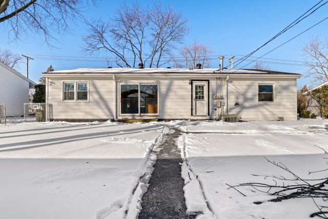 307 Oakwood Road Vernon Hills, IL 60061 - Photo 26 of 28 a view of a house with snow on the road