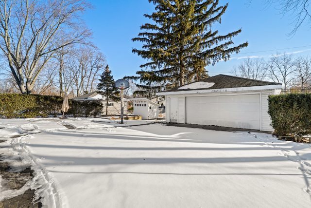 307 Oakwood Road Vernon Hills, IL 60061 - Photo 27 of 28 a view of a white house with a large tree with yard