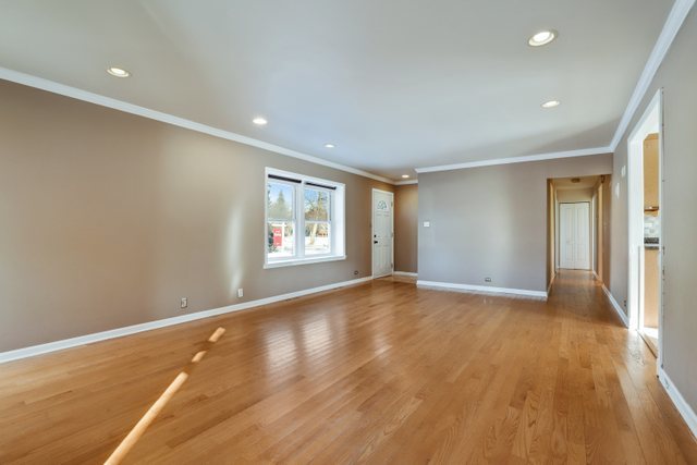 307 Oakwood Road Vernon Hills, IL 60061 - Photo 6 of 28 a view of an empty room with wooden floor and a window