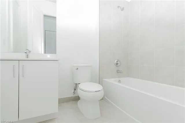 a bathroom with a toilet and a bathtub