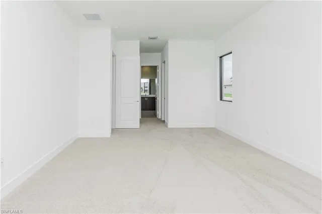 an empty room with a bathroom