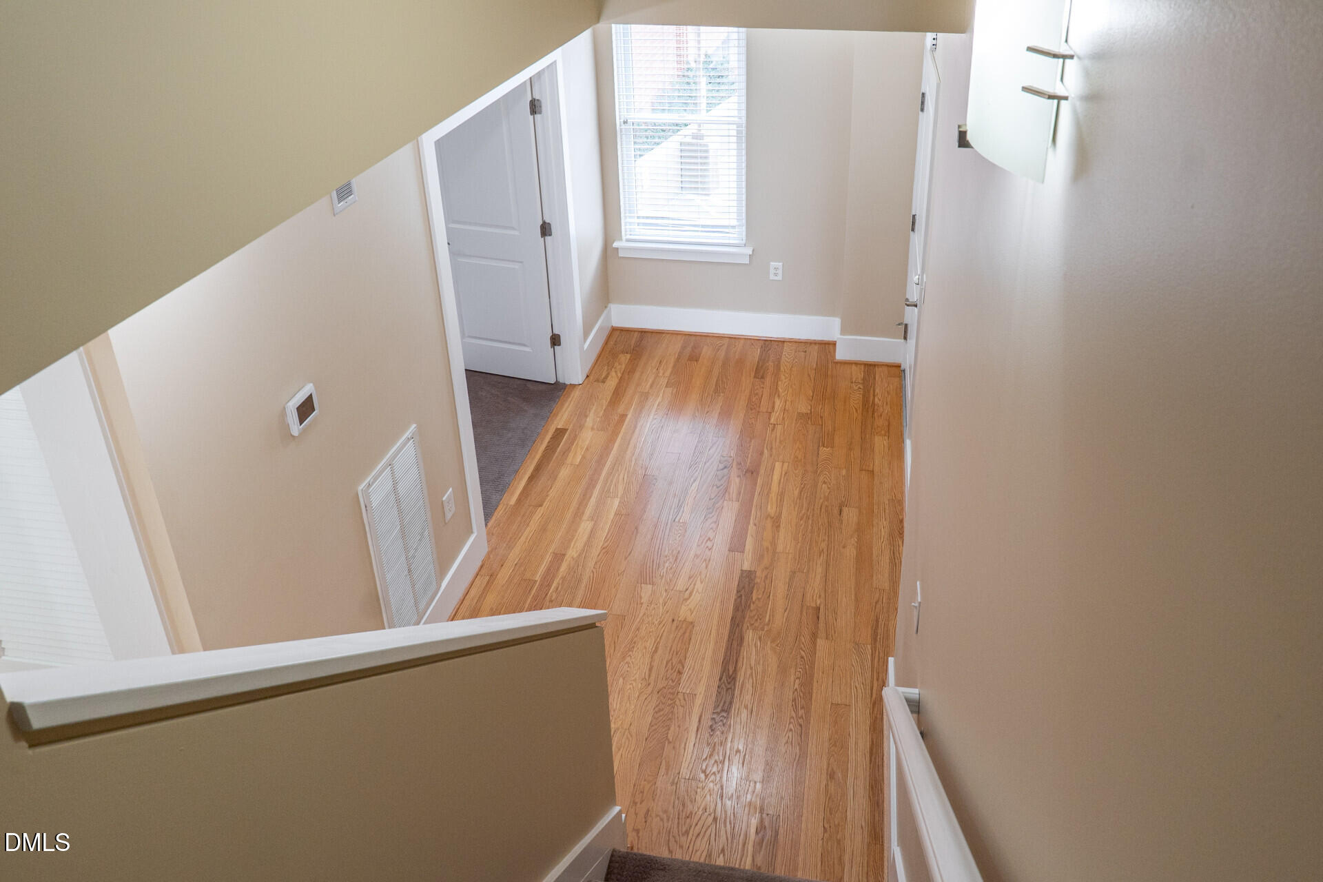 444 South Blount Street, Unit 328 Raleigh, NC 27601 - Photo 17 of 51 a view of a hallway with wooden floor and entryway