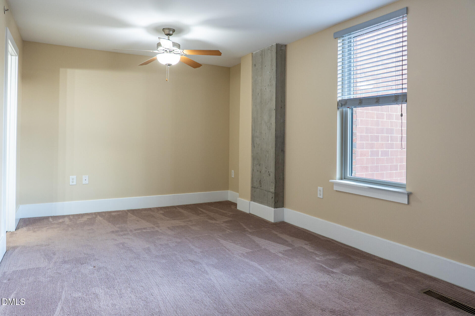 444 South Blount Street, Unit 328 Raleigh, NC 27601 - Photo 33 of 51 an empty room with windows and fan