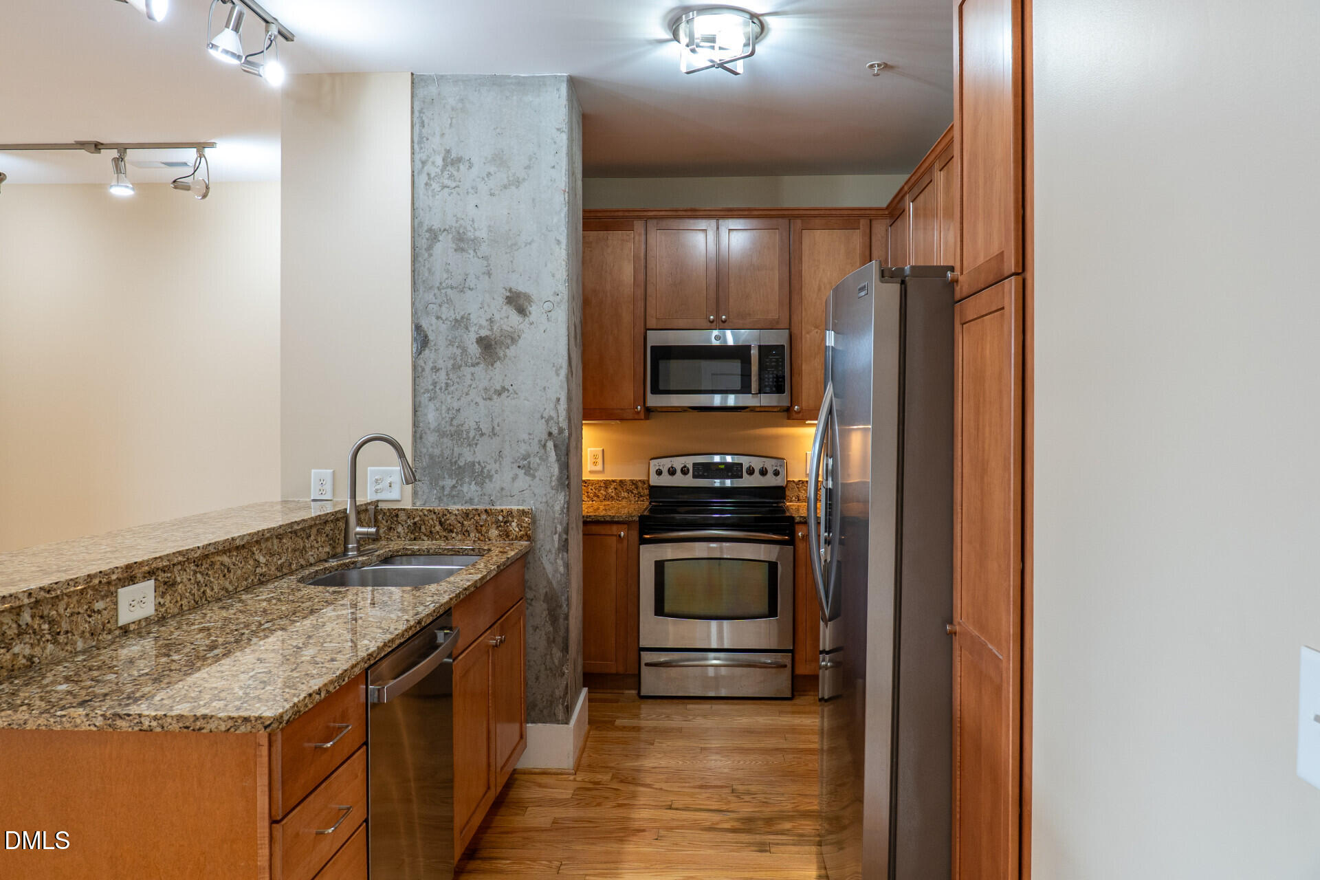 444 South Blount Street, Unit 328 Raleigh, NC 27601 - Photo 9 of 51 a kitchen with a sink stove and refrigerator