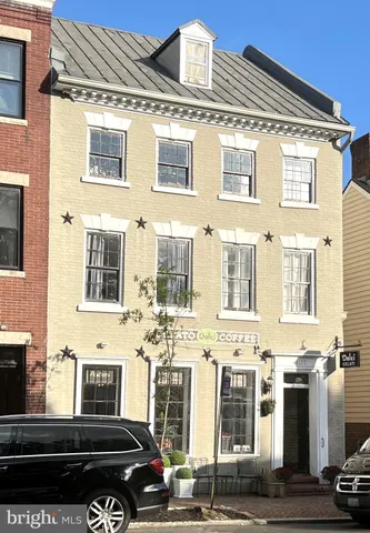 a front view of a building with a street